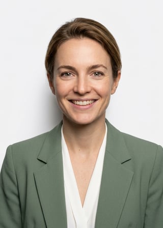 Professional AI LinkedIn headshot in Sage green blazer with white blouse (2026 trend) on White / Pure White Studio