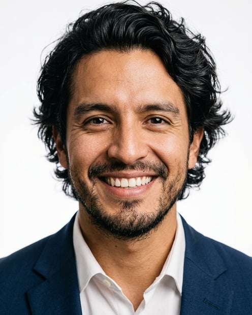 White / Pure White Studio · Navy tailored suit headshot example