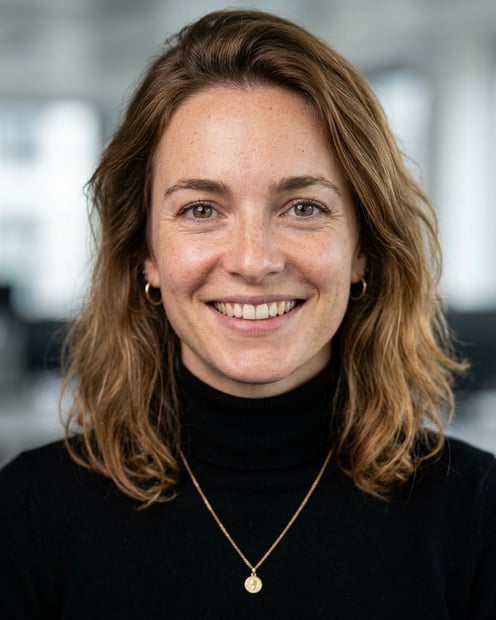 Office / Modern Office Workspace · Fitted black turtleneck headshot example