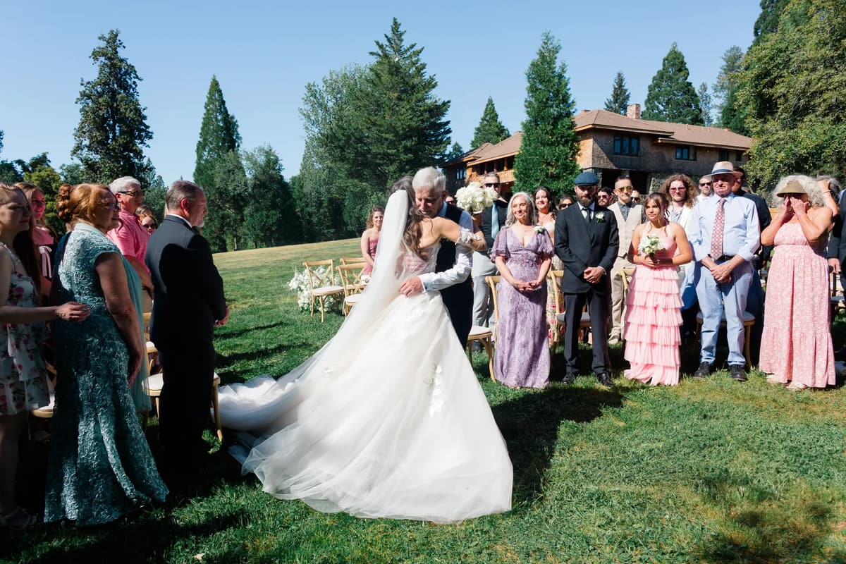 bride and father after walking down the aisle