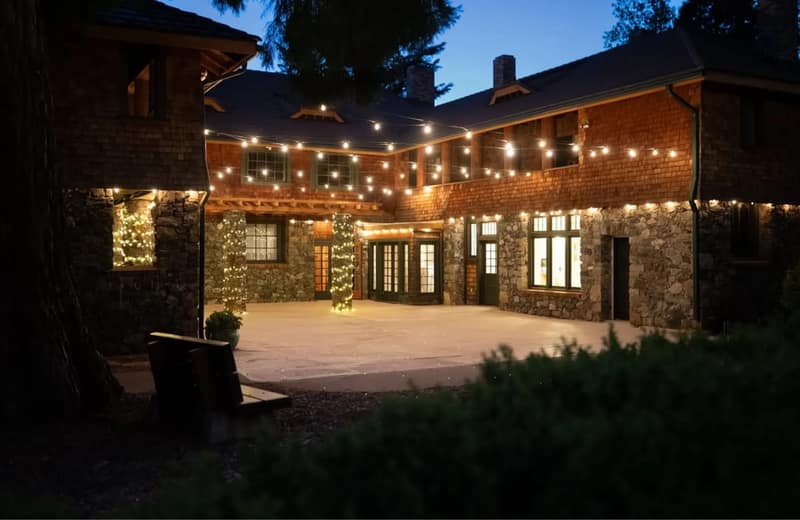 The Courtyard at North Star House lit with string lights at night