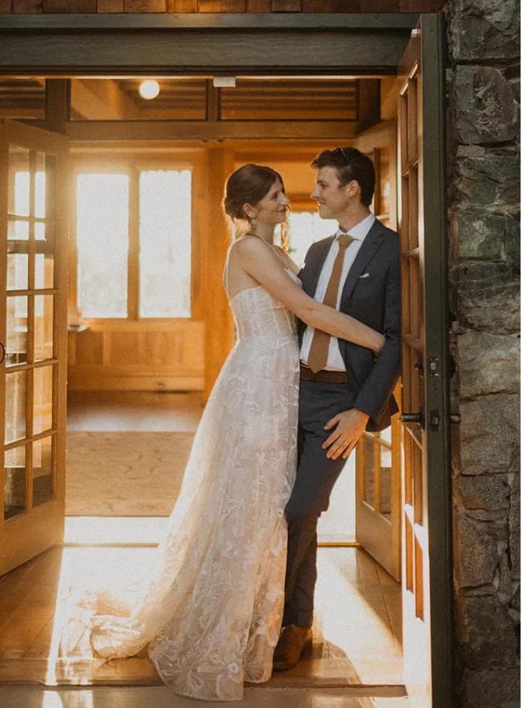 Couple embracing in a doorway inside North Star House