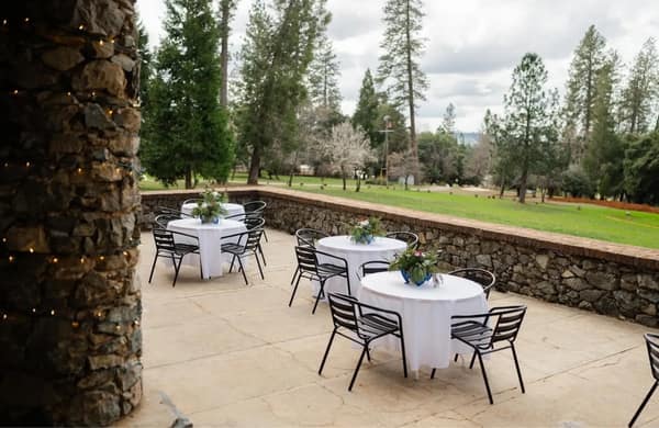 Cocktail tables set on the Terrace overlooking the grounds