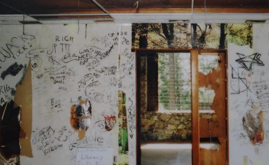 Library with graffitti and walls torn apart