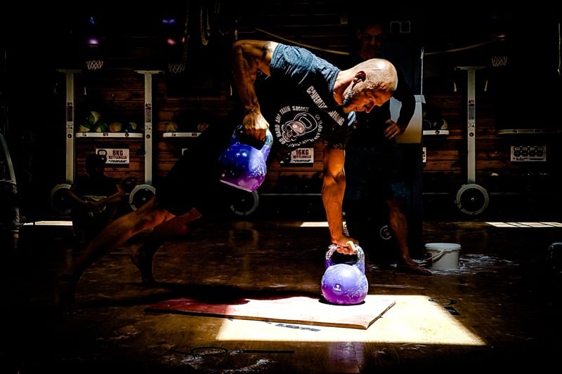 Coach assessing technique