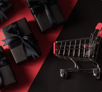 Shopping cart with laptop and gifts