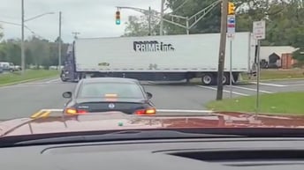 Truck drive takes out light pole