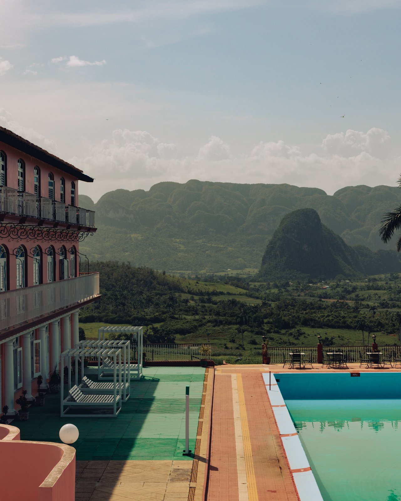 A hotel pool looking out to the Viñales mogotes, Cuba