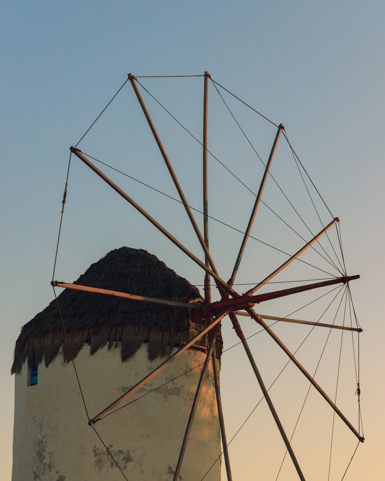 A traditional thatched-cap windmill against the sky, Mykonos, Greece