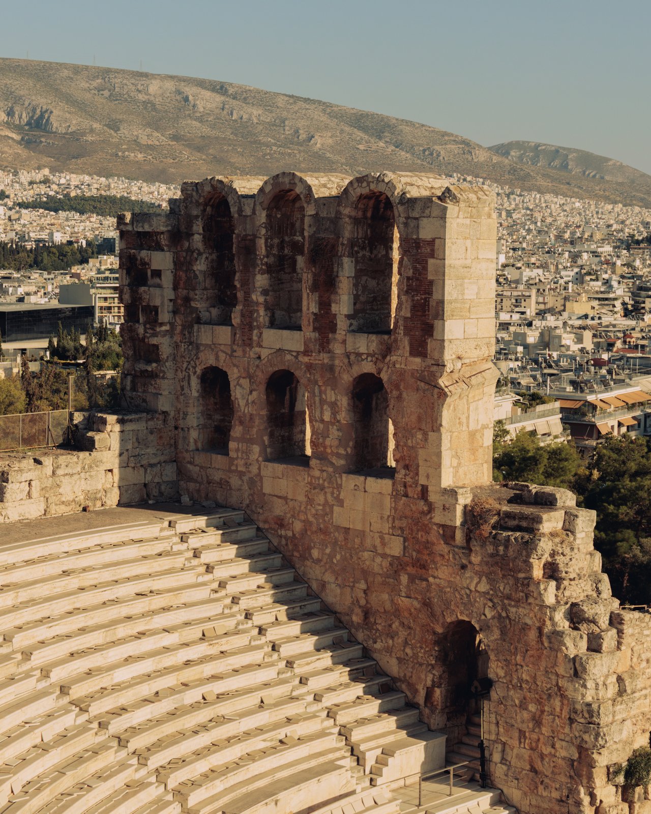 The ancient Odeon of Herodes Atticus below the Acropolis, Athens sprawling behind, Greece