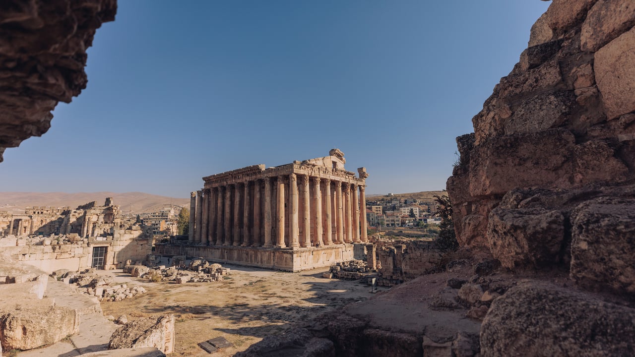 The Roman Temple of Bacchus at Baalbek, its colonnade framed by ancient ruins, Lebanon
