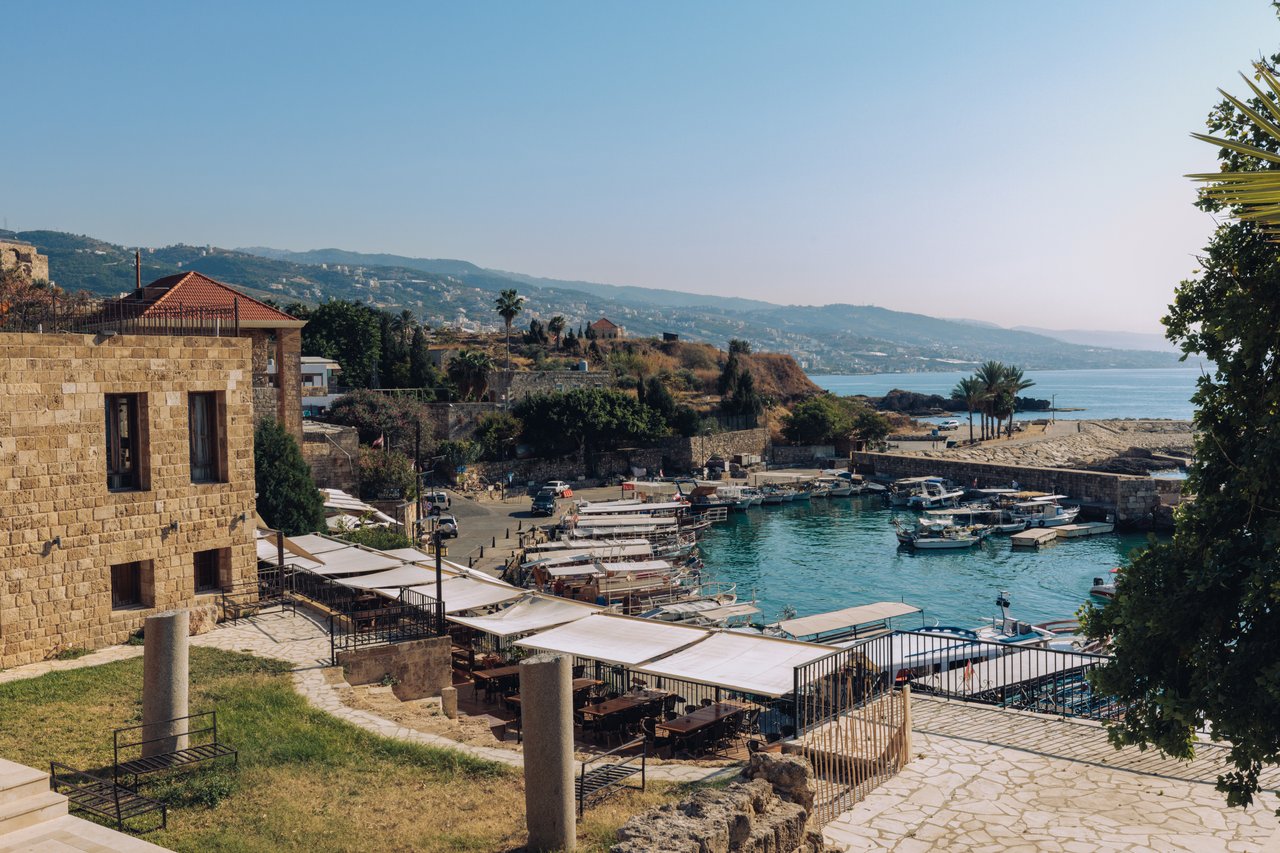 A traditional house courtyard with a citrus tree and a stone fountain basin, Lebanon