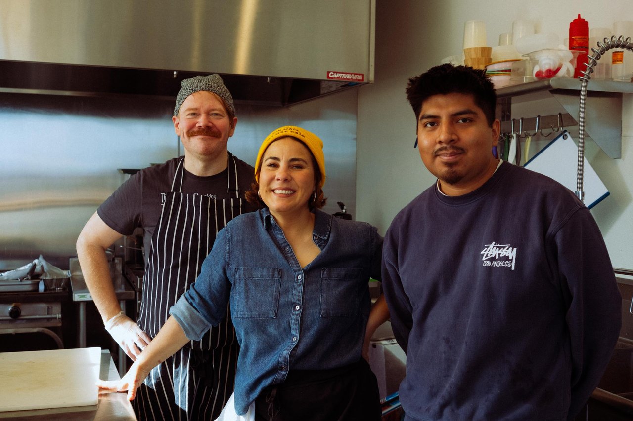 Three restaurant staff posing together in the kitchen, Kansas City