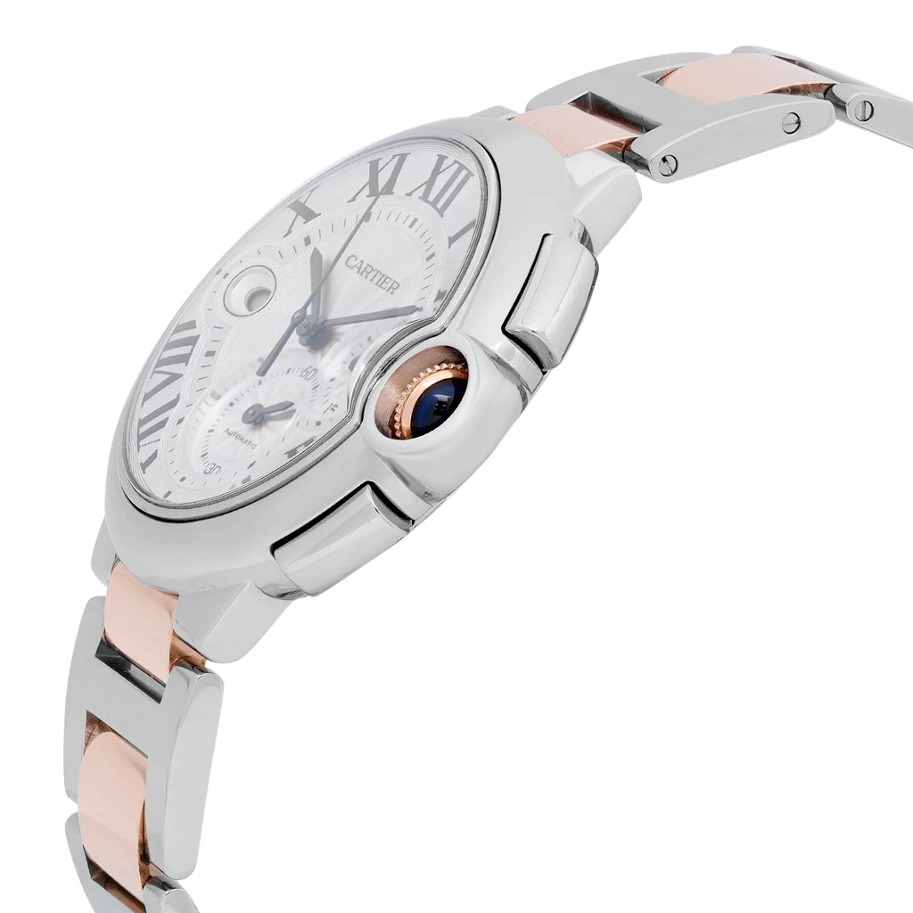 An image of a pre-owned Cartier men's wristwatch in a side profile view, highlighting the crown. The watch features a round shape with a silver dial, steel bezel, and a bracelet made of stainless steel and solid gold. It displays luxury and dress/formal style, including a chronograph, date indicator, and small seconds subdial. The crown is visible on the right side of the watch case, which is positioned at a slight angle to showcase the side details and the midsection of the band, with the camera at a close, but clear distance for detailed viewing.
