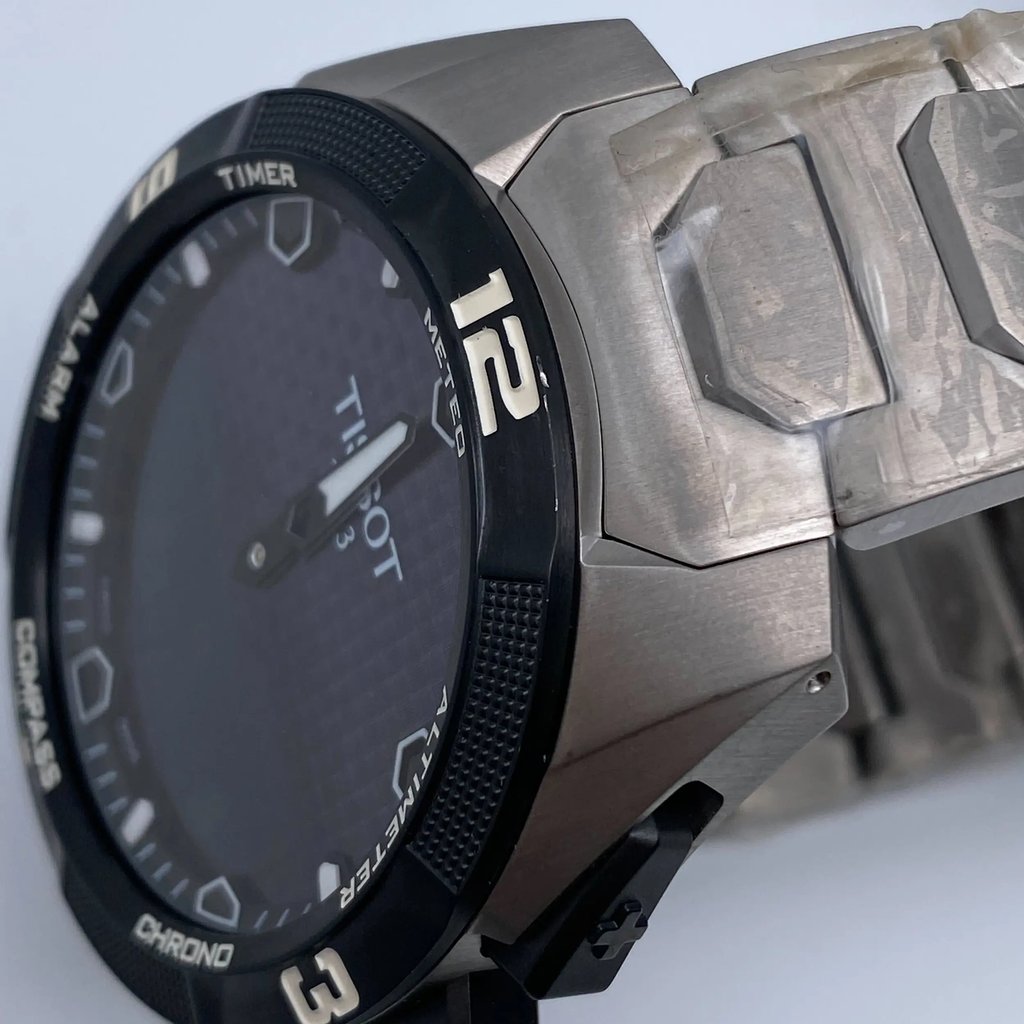View Of Crown Facing Side Of Tissot T091.420.44.051.00 Titanium Watch Display Model Condition