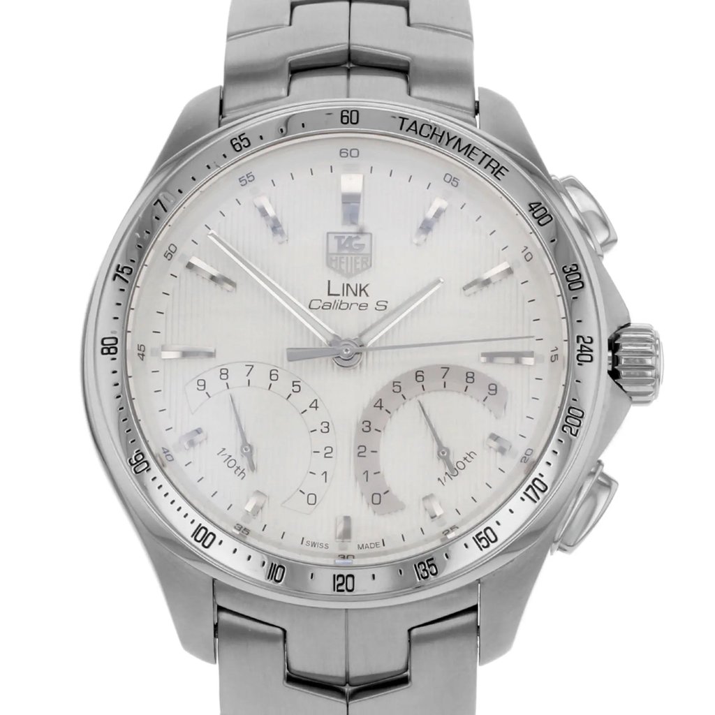 An image of a pre-owned TAG Heuer men's wristwatch, captured in a front close-up view. The round watch face features a silver dial with stick indices and chronograph sub-dials. The stainless steel case and band complement the sporty style, while luminous hands enhance visibility. The watch includes a tachymeter scale around the bezel.