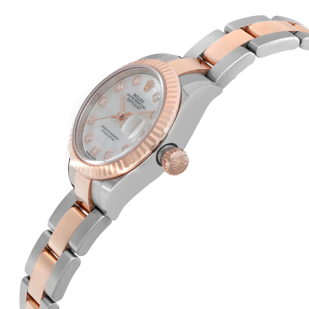An image of a pre-owned Rolex women's luxury wristwatch presented in a side profile view with the crown visible. The watch features a round shape with a white mother of pearl dial pattern and a date indicator. It has a rose gold bezel and the band is made of a combination of rose gold and stainless steel. The case material is stainless steel. The watch is positioned at a slight angle, with the face turned towards the viewer, and it is photographed from a close distance to show detail.
