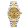 An image of a pre-owned wristwatch shown from a front full frontal view. The watch features a gold and silver-tone bracelet and a gold dial with a date display. The angle is straight on, capturing the watch at close range, highlighting its intricate details and dual-tone design.