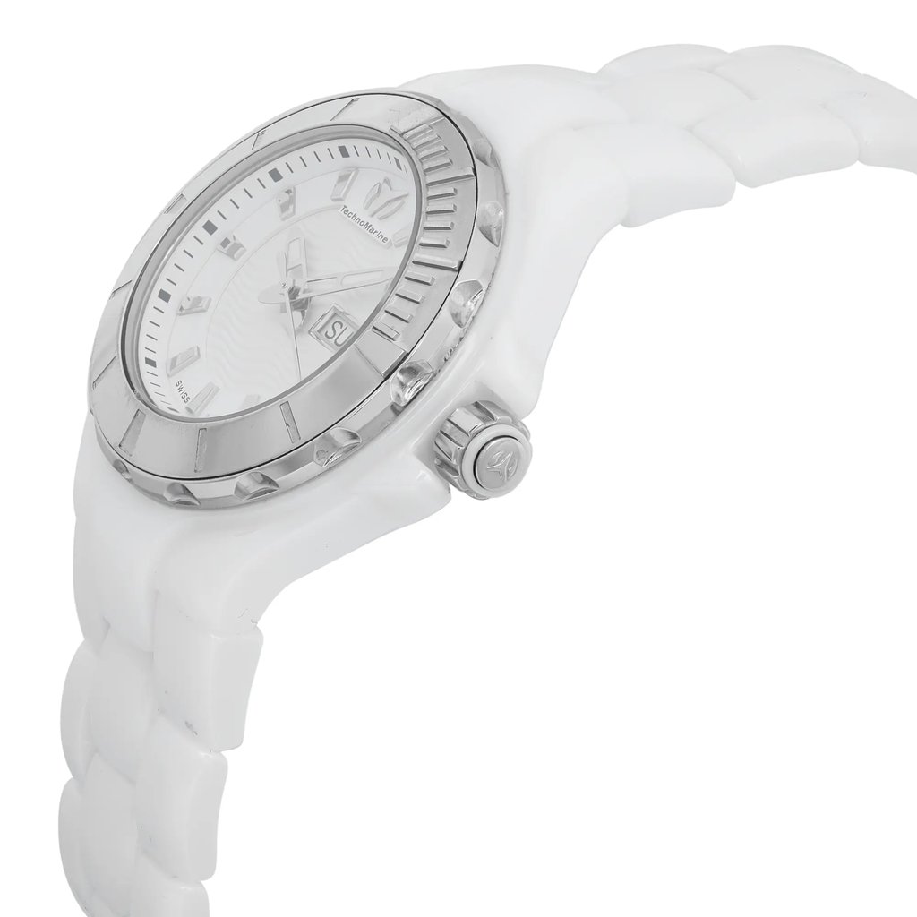 An image of a Wristwatch by TechnoMarine. This Pre Owned item is designed for Women, featuring a Sport style. It has a Quartz movement and an Analog display with a White dial color. The indices include 12-Hour Dial,Seconds Hand. The band is made of Ceramic and the case is made of Ceramic. The watch has a Round shape with a case size of 36 mm and a case thickness of 12 mm.