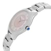 An image of an unworn RAYMOND WEIL women's wristwatch in a side profile view with the crown visible. The watch features a round stainless steel case connected to a stainless steel band. It has a casual and dress/formal style with a pink mother of pearl dial adorned with diamond hour markers. The photograph is taken from a close distance, focusing on the watch face and the upper part of the band at a slight angle, emphasizing the watch's shape and the side detail including the crown.