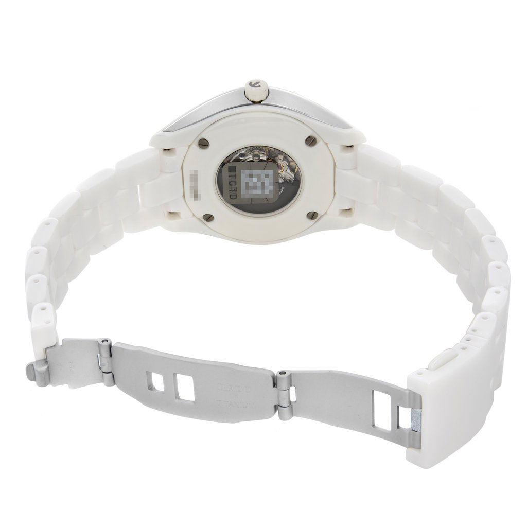 An image of a wristwatch taken from the back view, showcasing the open clasp. The watch has a white band and a silver clasp, with the inner mechanism visible through a transparent section on the back of the watch face. The angle is slightly elevated and close, highlighting the details of the clasp and the back of the watch. The watch is in display model condition.