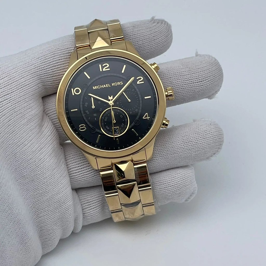 An image of a Wristwatch by Michael Kors. This Display Model item is designed for Men, featuring a Casual style. It has a Quartz movement and an Analog display with a Black dial color. The indices include 12-Hour Dial,Arabic Numerals,Multi Dial,Non-Numeric Hour Marks. The band is made of Stainless Steel and the case is made of Stainless Steel. The watch has a Round shape with a case size of 44 mm and a case thickness of 11 mm.