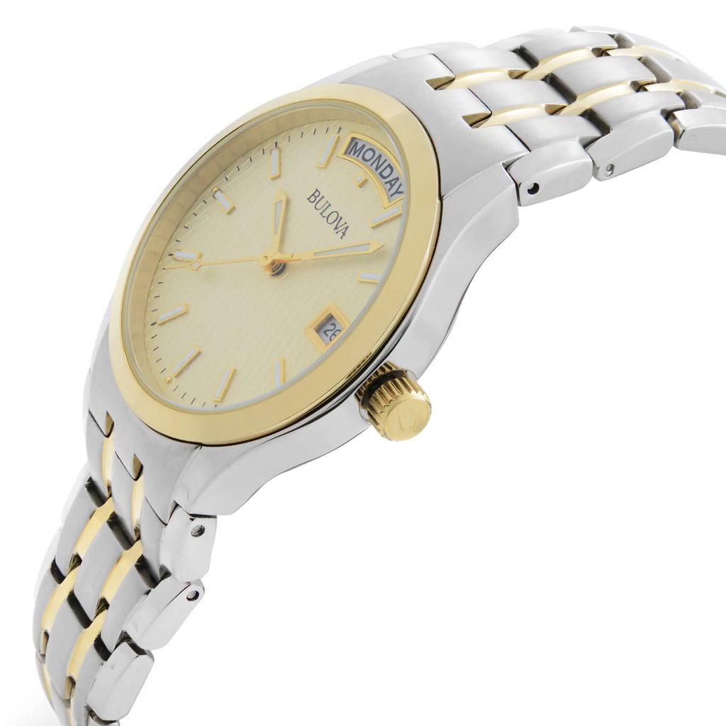 An image of a pre-owned Bulova men's wristwatch in a casual style, shown in a side profile view with the crown visible. The watch features a champagne dial with a diamond pattern, luminous hands, and day/date function at the three o'clock position. The bezel is gold-colored, complementing the stainless steel case and the two-tone stainless steel band. The watch has a round shape and is taken from a close distance, emphasizing the side angle and the details of the watch's design.