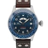 An image of a pre-owned IWC Timezoner Le Petit Prince Edition men's wristwatch taken from a front-facing angle at a close distance. The watch features a blue dial with luminous hands, a date display, and multiple city names on the bezel for time zone reference. The silver case is complemented by a brown leather strap with visible stitching and metal rivets. The crown is positioned on the right side of the watch.