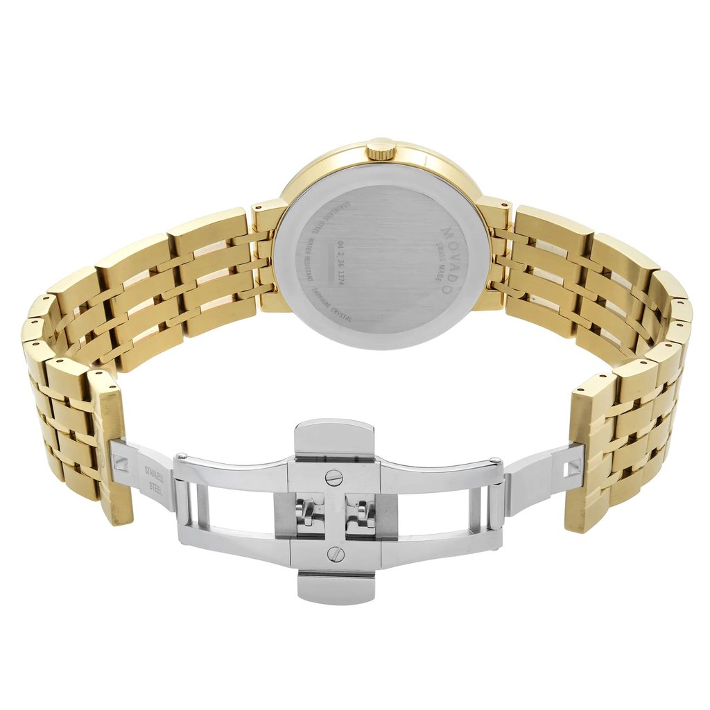 An image of a wristwatch shown from the back view, featuring an open clasp. The watch has a gold-toned metal link bracelet and a stainless steel case back. The angle is straight on, capturing the watch from a close distance, highlighting the details of the open clasp mechanism and the back of the watch face. The condition is noted as new with defects.