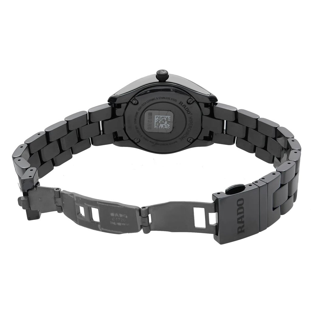 An image of a wristwatch displayed with a back view, showcasing the open clasp. The watch is positioned centrally, captured from a slight overhead angle at a close distance. The bracelet is extended, highlighting the details of the links and the brand's engraving on the clasp. The condition is a display model, indicating a pristine appearance.