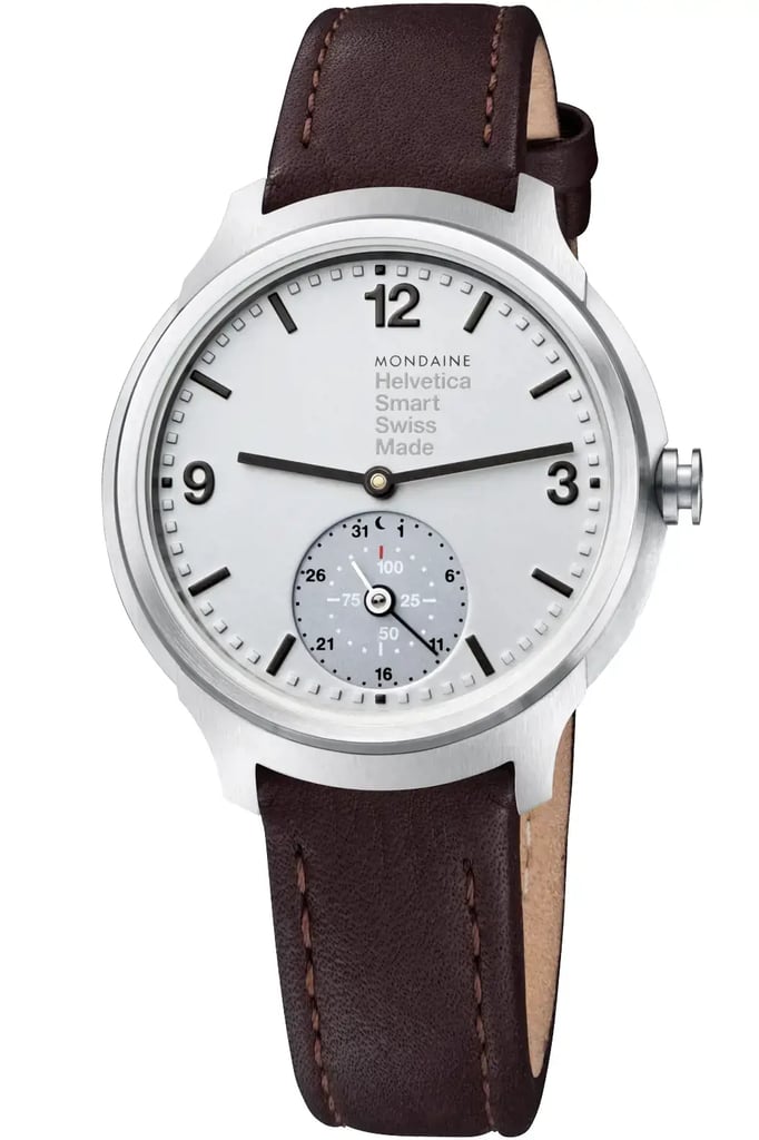 An image of a Wristwatch by Mondaine. This Unworn item is designed for Men, featuring a Casual style. It has a Quartz movement and an Analog display with a Silver dial color. The indices include 12-Hour Dial,Arabic Numerals,Stick Indexes. The band is made of Leather and the case is made of Stainless Steel. The watch has a Round shape with a case size of 44 mm and a case thickness of 13 mm.