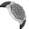 An image of a Vacheron Constantin men's wristwatch, viewed from an angled side profile. The pre-owned timepiece features a sleek black strap and a sophisticated grey dial with luminous hands and a date indicator. The watch is positioned at a slight angle, showcasing its silver-toned case and intricate details from a close distance.