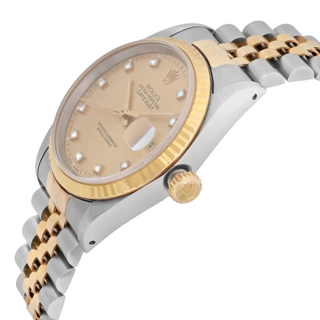 An image of a pre-owned men's Rolex wristwatch, featuring a two-tone metal band and a champagne-colored dial with diamond hour markers. The watch is positioned at a slight angle, showcasing the side profile and the crown with the Rolex logo. The date indicator is prominently displayed through a magnified window. The image captures the watch from a close distance, highlighting the intricate details of the design.