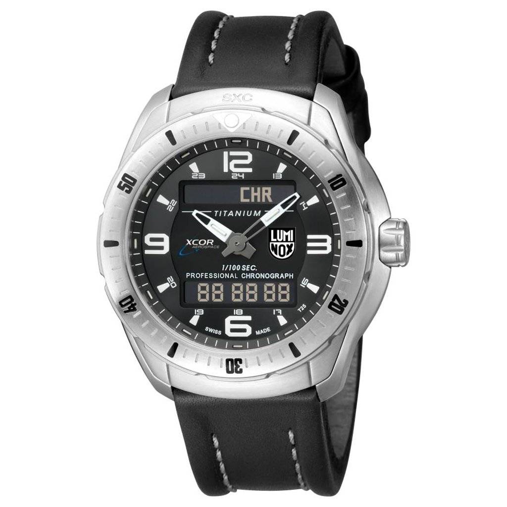 An image of a Wristwatch by Luminox. This New With Defects item is designed for Men, featuring a Dress/Formal style. It has a Quartz movement and an Analog display with a Black dial color. The indices include 12-Hour Dial,24-Hour Dial,Arabic Numerals. The band is made of Leather and the case is made of Titanium. The watch has a Round shape with a case size of 46 mm and a case thickness of 14 mm.