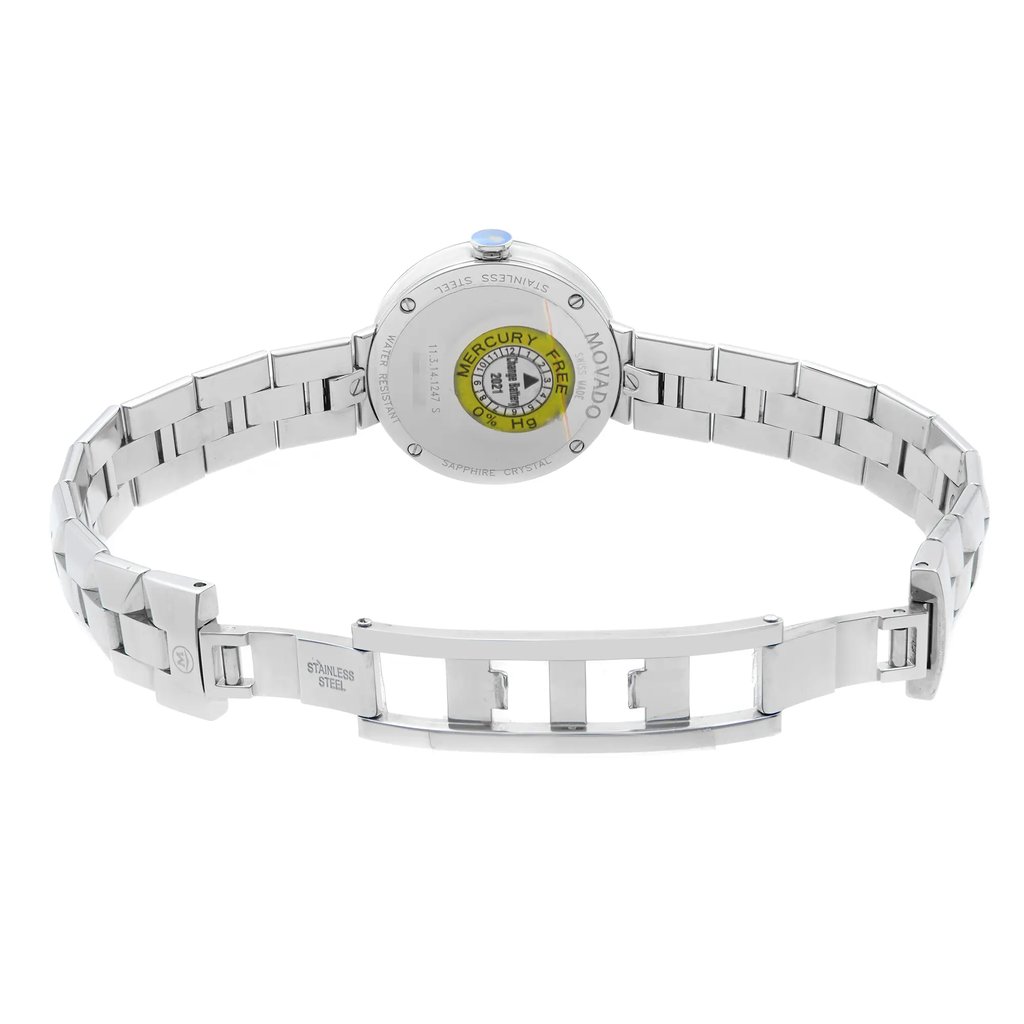 An image of a wristwatch displayed from the back view, showcasing an open clasp. The watch is positioned centrally with the metal bracelet extended, allowing a clear view of the stainless steel links. The case back is visible, featuring engravings and a circular emblem indicating "Mercury Free." The angle captures the watch from a slight overhead perspective, providing a comprehensive look at the design and condition as a display model.