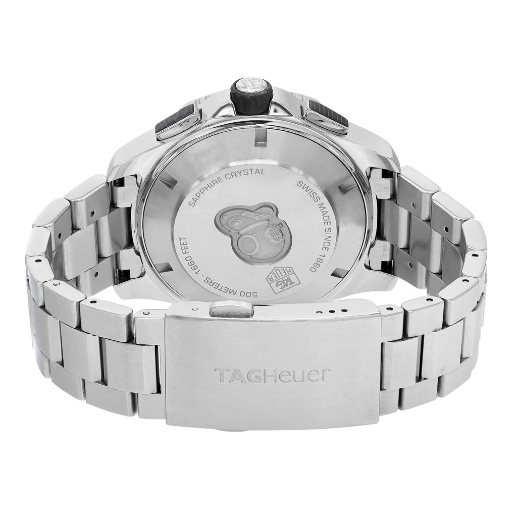 An image of a pre-owned men's TAG Heuer wristwatch captured from the back view, showcasing the solid stainless steel caseback. The watch is positioned upright with a focus on the closed fold-over clasp with double push button, engraved with the TAG Heuer logo. The stainless steel band is prominently displayed, highlighting the watch's round shape and the robust design of the clasp. The angle and close distance emphasize the craftsmanship and materials used in the watch's construction.