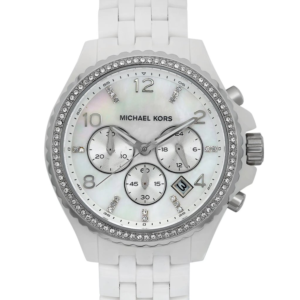 An image of a Wristwatch by Michael Kors. This Pre Owned item is designed for Women, featuring a Casual style. It has a Quartz movement and an Analog display with a White Mother of Pearl dial color. The indices include 12-Hour Dial,Arabic Numerals,Non-Numeric Hour Marks. The band is made of Acrylic and the case is made of Plastic. The watch has a Round shape with a case size of 44 mm and a case thickness of 13 mm.
