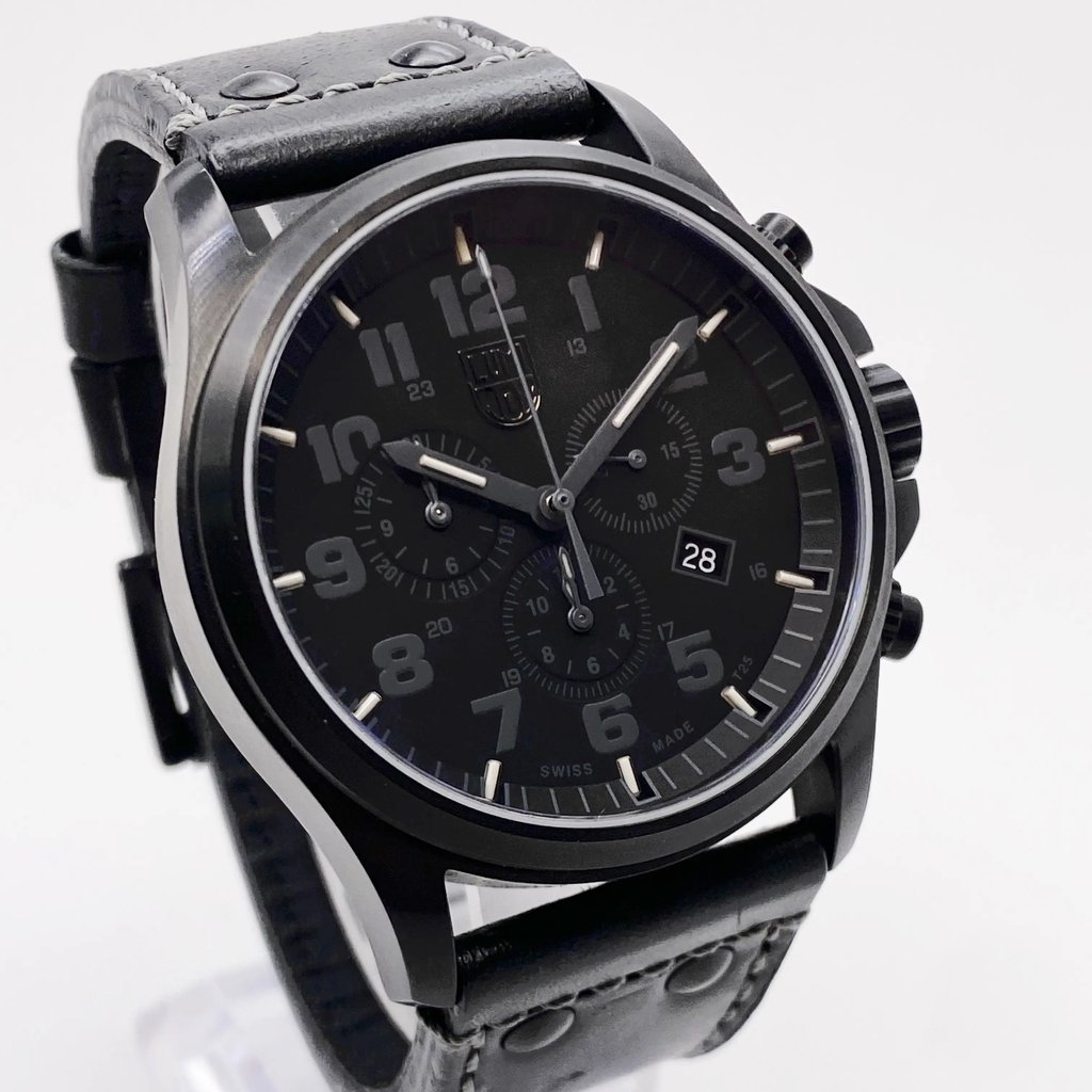 An image of a Wristwatch by Luminox. This Pre Owned item is designed for Men, featuring a Casual,Classic,Diver,Dress/Formal,Military,Sport style. It has a Quartz movement and an Analog display with a Black dial color. The indices include 12-Hour Dial,Arabic Numerals,Multi Dial. The band is made of Leather and the case is made of Stainless Steel. The watch has a Round shape with a case size of 45 mm and a case thickness of 14 mm.