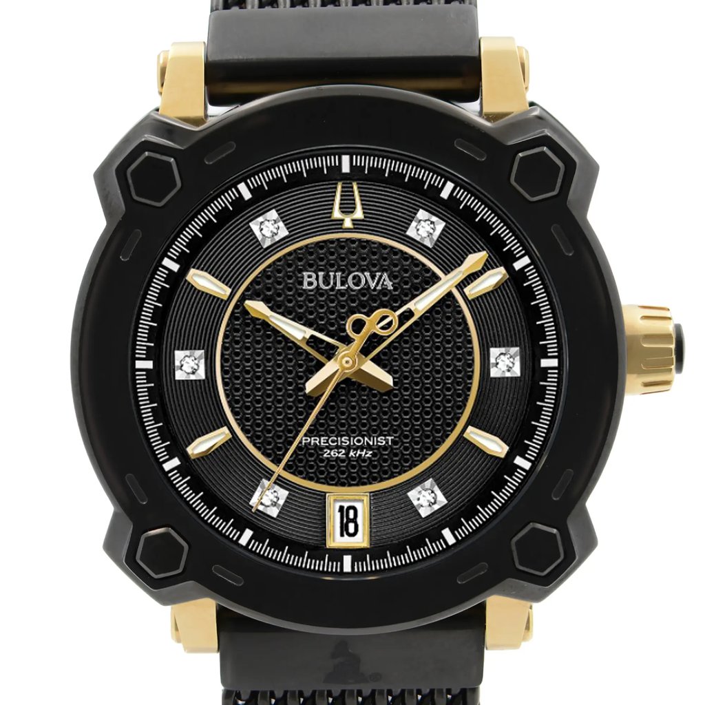 An image of a close-up front view of a women's Bulova dress/formal wristwatch. The display model features a round black dial with diamond markers and non-numeric hour marks, luminous hands, and a date indicator at the 3 o'clock position. The bezel is also black with hexagonal accents, and the case and band are made of stainless steel with gold-tone highlights. The Bulova logo and the word "PRECISIONIST" are visible on the dial. The watch is centered and fills the frame, offering a clear view of its design and features.