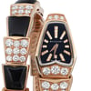 An image of a wristwatch taken from a front close-up angle, highlighting the watch face. The watch is pre-owned, featuring a black dial with gold-tone hour markers embellished with diamonds. The band is adorned with alternating sections of black enamel and diamond clusters, set in a gold-tone material. The brand name is visible on the watch face.