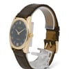 An image of a pre-owned men's Rolex wristwatch displayed at a slight angle from the front and right side. The watch features a rose gold case with a black dial, showcasing Arabic numerals and elegant watch hands. The brand name "Rolex" and "Cellini" are visible on the dial. It is positioned on a transparent stand, highlighting its brown leather strap with visible stitching. The watch is captured at a close distance, emphasizing its luxurious details.