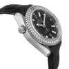 An image of a pre-owned wristwatch shown from a side profile view, opposite the crown. The watch has a silver case with a diamond-studded bezel and a black dial. The angle highlights the sleek design and textured leather strap, captured at a close distance.