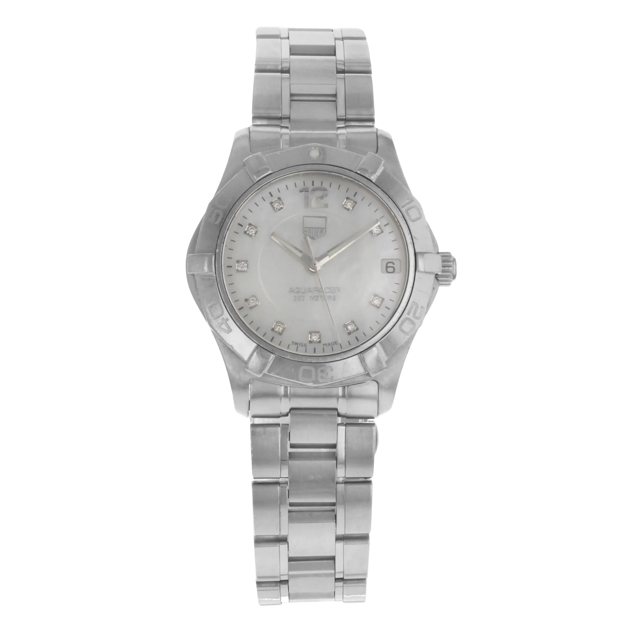 An image of a Wristwatch by TAG Heuer. This Pre Owned item is designed for Women, featuring a Classic style. It has a Quartz movement and an Analog display with a White Mother Of Pearl dial color. The indices include Diamonds. The band is made of Stainless Steel and the case is made of Stainless Steel. The watch has a Round shape with a case size of 32 mm and a case thickness of 10 mm.