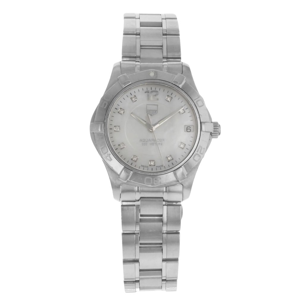 An image of a Wristwatch by TAG Heuer. This Pre Owned item is designed for Women, featuring a Classic style. It has a Quartz movement and an Analog display with a White Mother Of Pearl dial color. The indices include Diamonds. The band is made of Stainless Steel and the case is made of Stainless Steel. The watch has a Round shape with a case size of 32 mm and a case thickness of 10 mm.