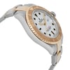 An image of a pre-owned wristwatch shown from a side profile view, opposite of the crown. The watch features a two-tone metal bracelet and a prominent bezel with engraved numbers. The dial is white with bold markers and hands, providing a clear view of the watch's intricate details. The angle highlights the watch's thickness and design, capturing it from a close distance.