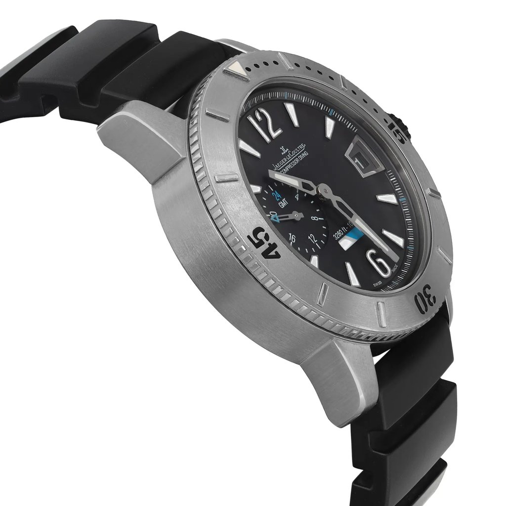 An image of a pre-owned wristwatch, viewed from a side profile opposite the crown. The watch features a black dial with bold numerals and a stainless steel bezel marked with minute indicators. It has a black rubber strap, and the angle emphasizes the watch's depth and texture. The photograph is taken at a close distance, highlighting the details and craftsmanship.