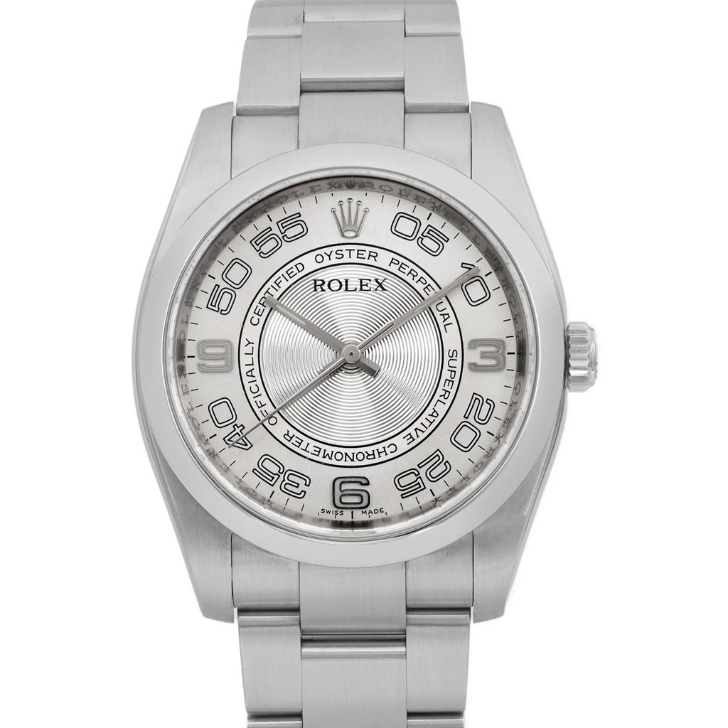 An image of a pre-owned wristwatch, captured in a front close-up shot focusing on the watch face. The watch features a metallic band and a detailed dial with bold numerals and intricate designs. The brand name is visible on the face, emphasizing its authenticity and style.