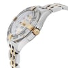 An image of a pre-owned Breitling women's luxury wristwatch, captured from a side profile angle showcasing the crown which is yellow gold. The watch has a round shape with a white Mother of Pearl dial and a steel bezel. It features a two-tone stainless steel and yellow gold band, and the watch is positioned at a close distance to provide a clear view of its details. The watch is pre-owned and may show minor signs of wear.