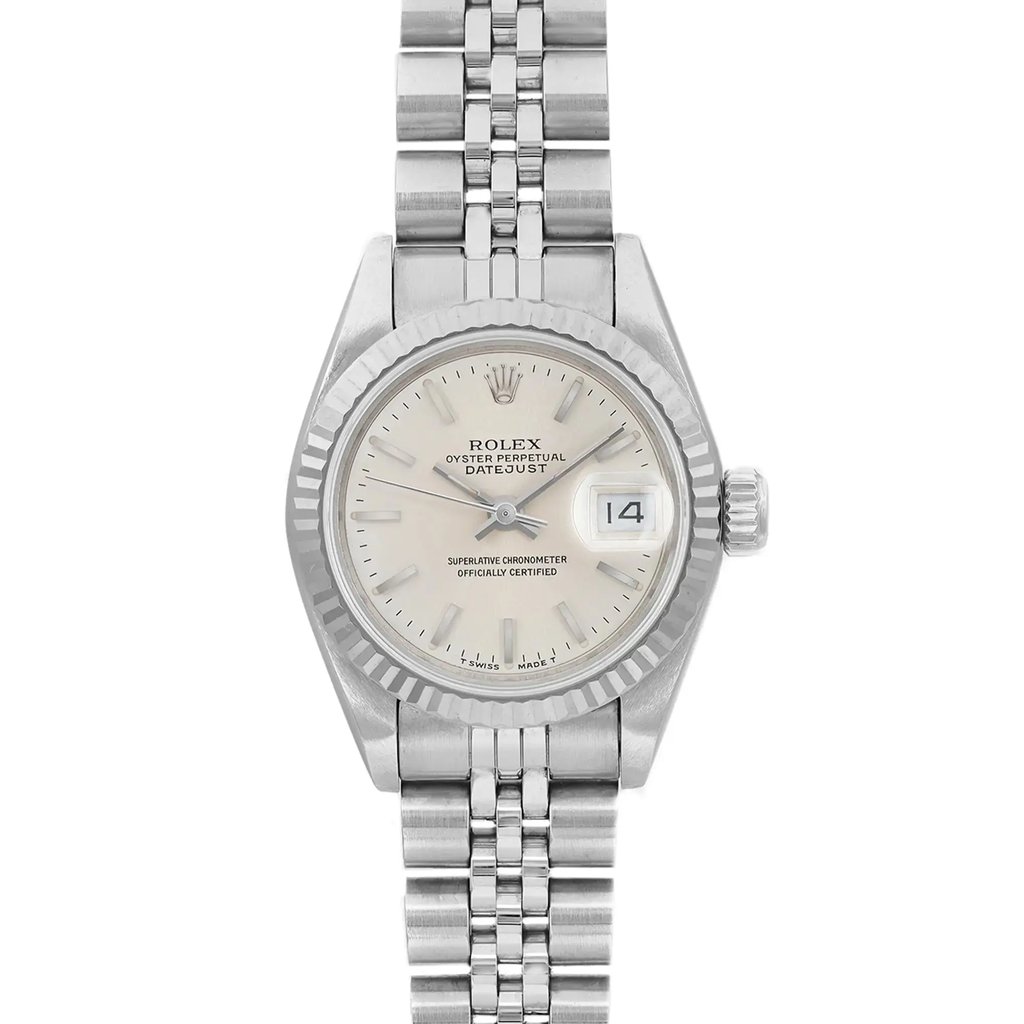 An image of a pre-owned wristwatch captured in a front close-up shot, focusing on the watch face. The watch displays a classic design with a metallic bracelet, a round dial, and a date feature on the right side. The angle and proximity highlight the intricate details of the watch's face and bezel.