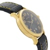 An image of a pre-owned Montblanc women's dress/formal wristwatch presented in a side profile view opposite of the crown, positioned at a close distance. The watch features a round stainless steel case with a gold tone, showing micro scratches on its surface. The black dial includes a date indicator and is complemented by a leather band, which displays minor signs of wear and small rips along the edges. The watch embodies an elegant design suitable for formal occasions.